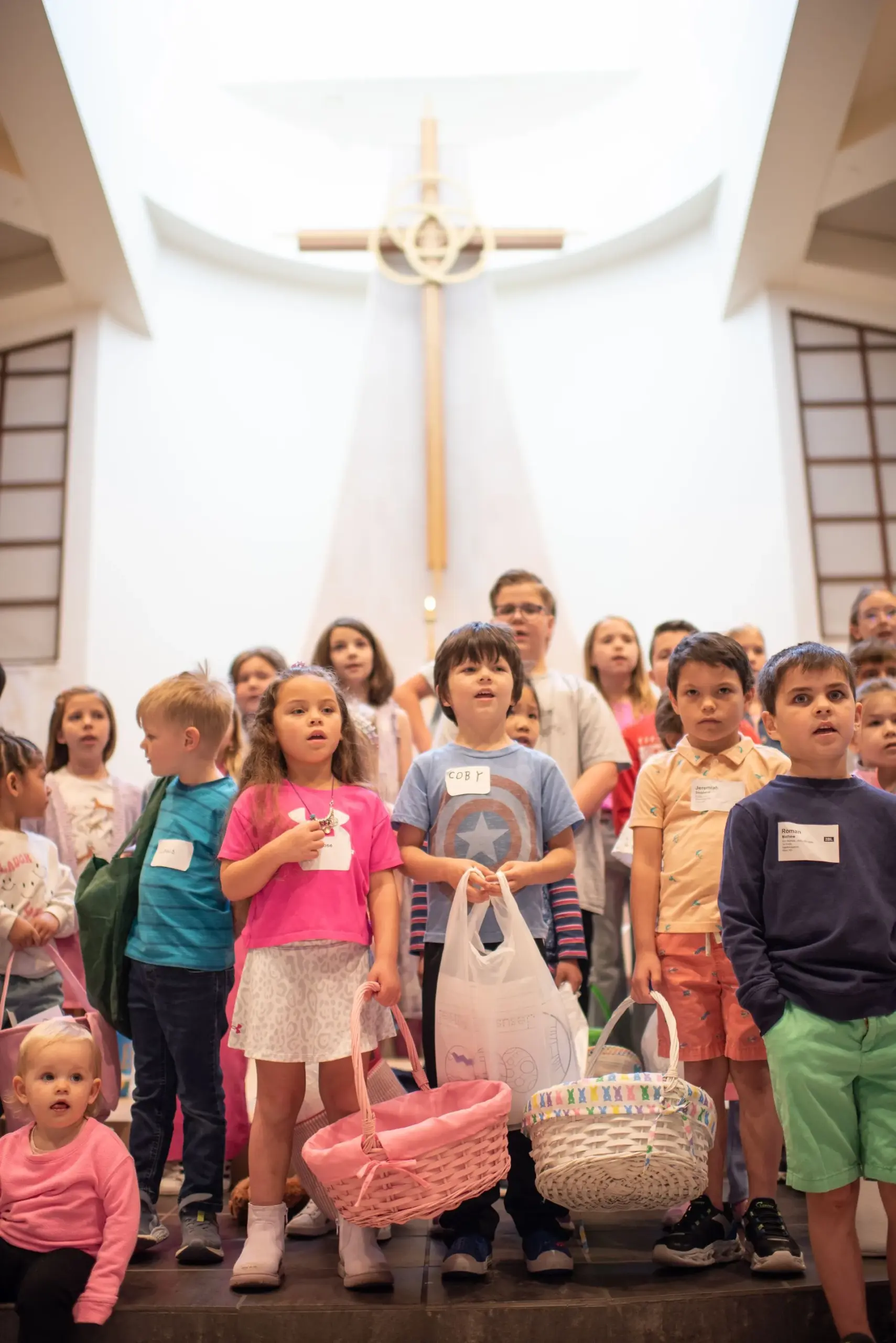 Kids ministry at Holy Trinity Lutheran three men and laughing two women walking side by side